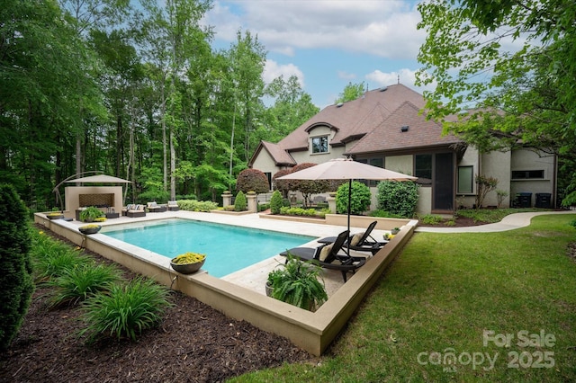 outdoor pool featuring a patio and a lawn