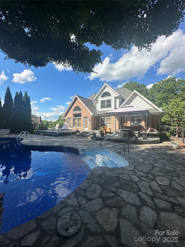 outdoor pool featuring a patio