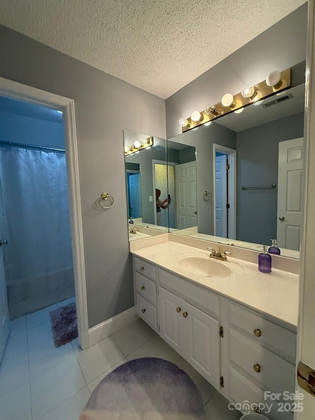 504 Johnsfield Rd, Shelby, NC 28150 - full bathroom with tile patterned floors, vanity, a textured ceiling, and a shower with curtain