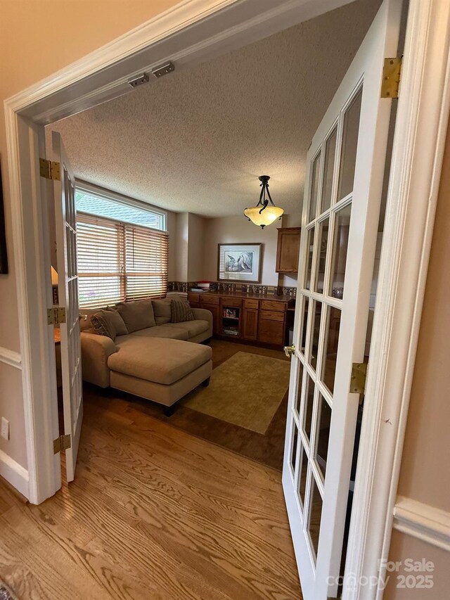 504 Johnsfield Rd, Shelby, NC 28150 - living room featuring wood finished floors and a textured ceiling