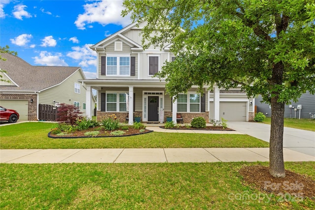 10906 Charmont Pl, Huntersville, NC 28078 - craftsman inspired home featuring concrete driveway, a front yard, a porch, and stone siding