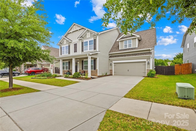 10906 Charmont Pl, Huntersville, NC 28078 - craftsman house featuring concrete driveway, an attached garage, covered porch, and a shingled roof