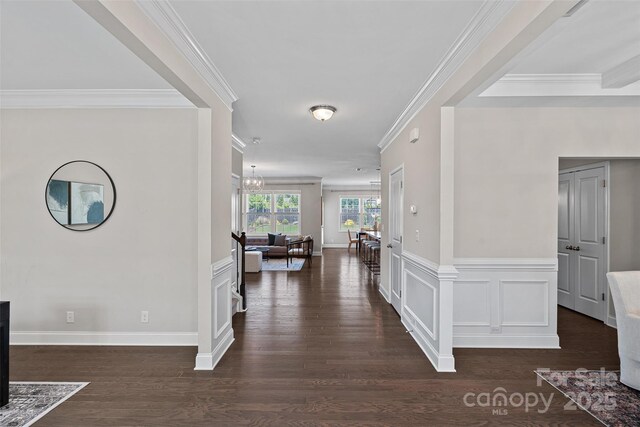 10906 Charmont Pl, Huntersville, NC 28078 - hall featuring dark wood-style floors, ornamental molding, and a chandelier
