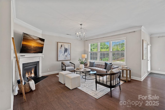 10906 Charmont Pl, Huntersville, NC 28078 - living room featuring ornamental molding, dark wood-type flooring, a chandelier, baseboards, and a fireplace with flush hearth