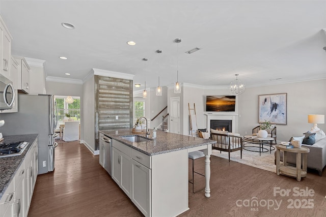 10906 Charmont Pl, Huntersville, NC 28078 - kitchen with a sink, a kitchen breakfast bar, open floor plan, dark wood-type flooring, and recessed lighting