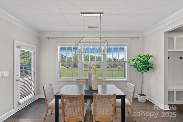10906 Charmont Pl, Huntersville, NC 28078 - dining space with a chandelier, baseboards, ornamental molding, and healthy amount of natural light
