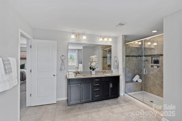 10906 Charmont Pl, Huntersville, NC 28078 - ensuite bathroom featuring a stall shower, double vanity, tile patterned floors, and baseboards