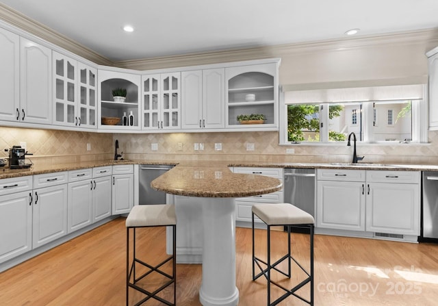 4429 Cameron Oaks Dr, Charlotte, NC 28211 - kitchen with a sink, a kitchen breakfast bar, open shelves, dishwasher, and light wood finished floors