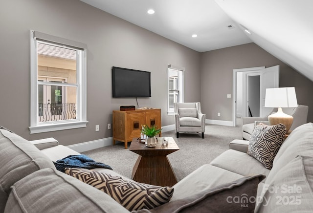 4429 Cameron Oaks Dr, Charlotte, NC 28211 - carpeted living area featuring lofted ceiling, baseboards, and plenty of natural light