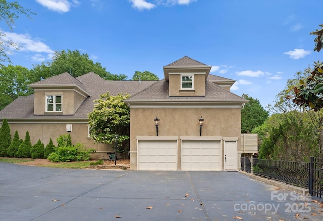4429 Cameron Oaks Dr, Charlotte, NC 28211 - traditional-style home featuring concrete driveway, a shingled roof, stucco siding, and fence