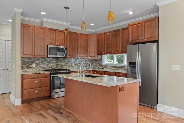 38 Unadilla Aly, Asheville, NC 28803 - kitchen featuring appliances with stainless steel finishes, a sink, ornamental molding, tasteful backsplash, and light wood-style floors