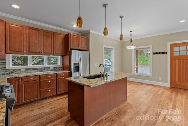38 Unadilla Aly, Asheville, NC 28803 - kitchen with stainless steel refrigerator with ice dispenser, a sink, light wood-style floors, decorative light fixtures, and ornamental molding