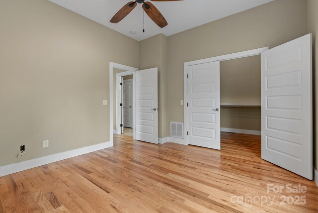 38 Unadilla Aly, Asheville, NC 28803 - unfurnished bedroom featuring light wood finished floors, baseboards, and a closet