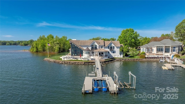 3386 Governors Island Dr, Denver, NC 28037 - dock area featuring a water view, boat lift, and a patio