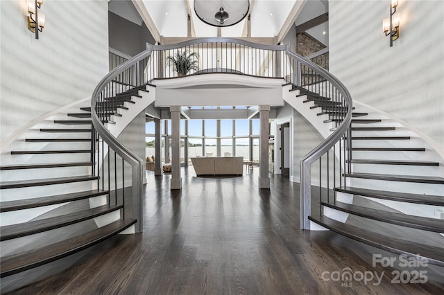 3386 Governors Island Dr, Denver, NC 28037 - staircase featuring a high ceiling, wood finished floors, and decorative columns