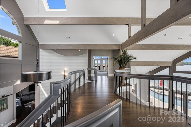 3386 Governors Island Dr, Denver, NC 28037 - hall with an upstairs landing, a skylight, and wood finished floors