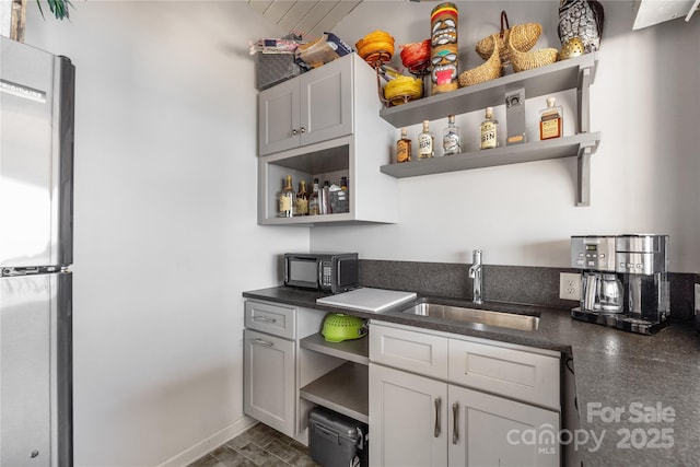 3386 Governors Island Dr, Denver, NC 28037 - bar area with a sink, stainless steel refrigerator, and black microwave