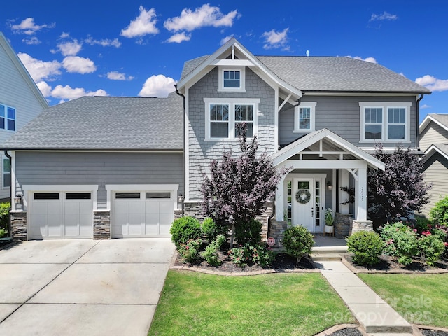 2025 Masons Bend Dr, Fort Mill, SC 29708 - craftsman-style house featuring stone siding, concrete driveway, an attached garage, and a shingled roof