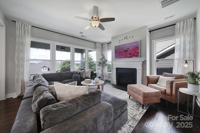 2025 Masons Bend Dr, Fort Mill, SC 29708 - living area with a fireplace with flush hearth, a ceiling fan, and wood finished floors