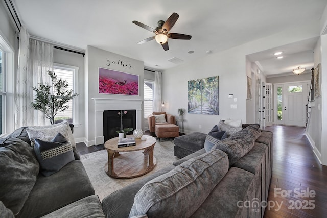 2025 Masons Bend Dr, Fort Mill, SC 29708 - living room featuring hardwood / wood-style floors, a glass covered fireplace, a ceiling fan, baseboards, and recessed lighting