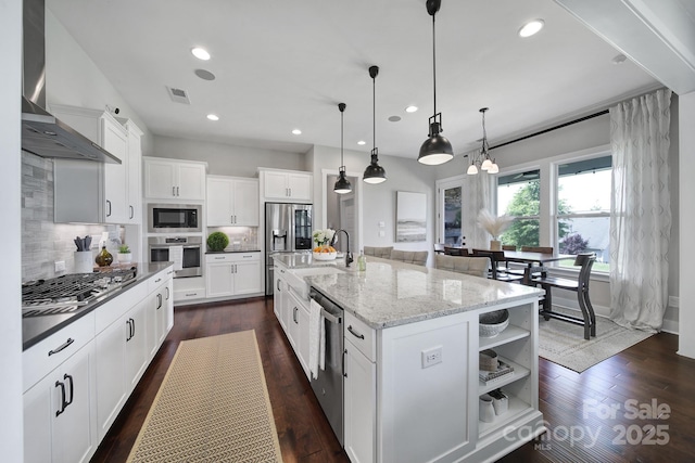 2025 Masons Bend Dr, Fort Mill, SC 29708 - kitchen with appliances with stainless steel finishes, a sink, wall chimney range hood, backsplash, and white cabinetry