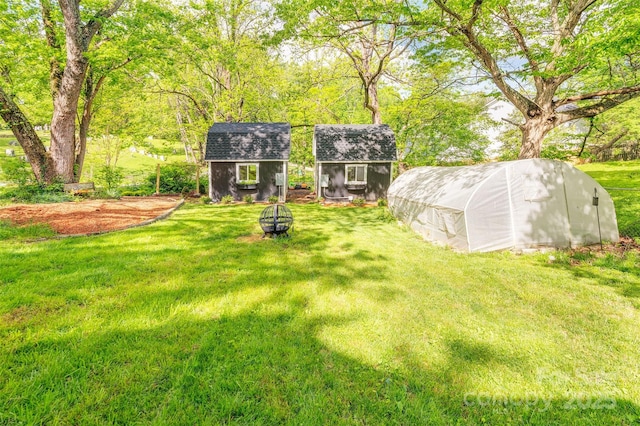 9 N St, Weaverville, NC 28787 - view of green lawn featuring an outdoor structure and a storage unit