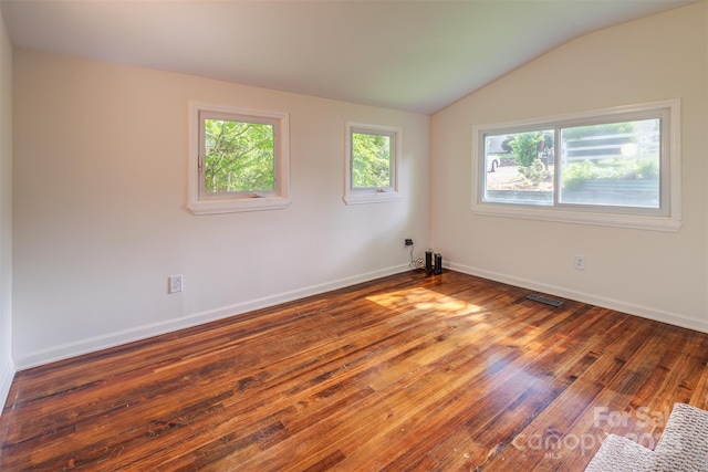 9 N St, Weaverville, NC 28787 - empty room featuring hardwood / wood-style floors, vaulted ceiling, and baseboards