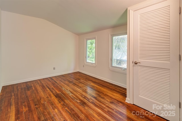 9 N St, Weaverville, NC 28787 - unfurnished room with vaulted ceiling, baseboards, and dark wood-style flooring