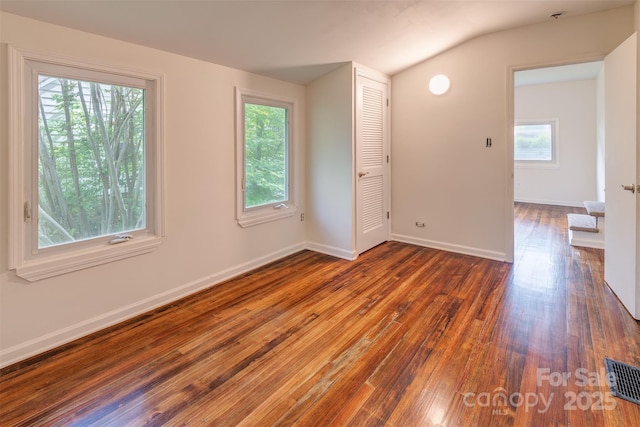 9 N St, Weaverville, NC 28787 - spare room featuring hardwood / wood-style flooring, vaulted ceiling, and baseboards