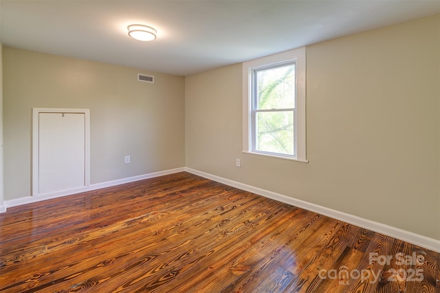 9 N St, Weaverville, NC 28787 - unfurnished room featuring baseboards and dark wood-type flooring