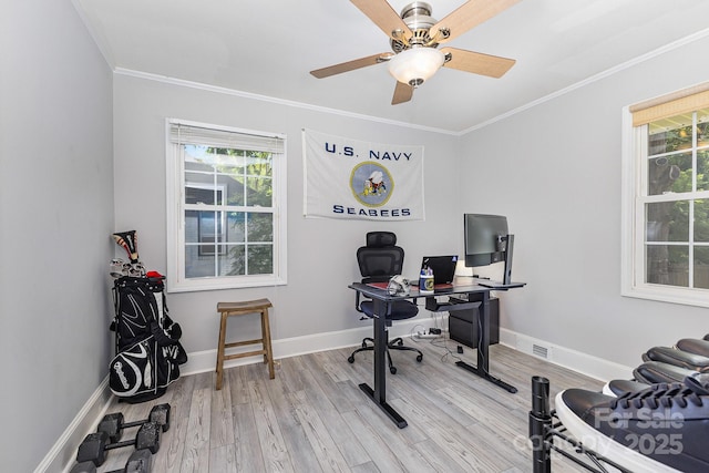 office area featuring ornamental molding, light wood-style flooring, ceiling fan, and baseboards