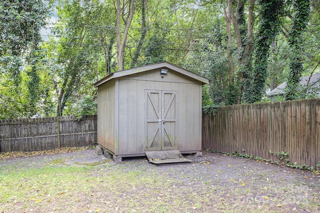 view of shed with a fenced backyard