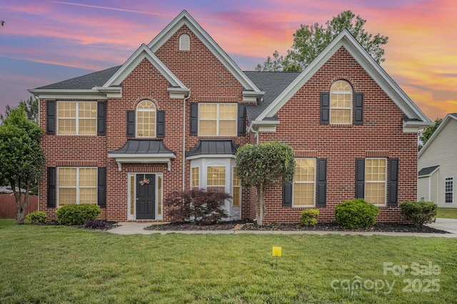 15037 Taylor Ridge Ln Unit 25, Charlotte, NC 28273 - colonial house with a front yard and brick siding