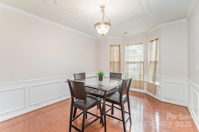 15037 Taylor Ridge Ln Unit 25, Charlotte, NC 28273 - dining room with light wood finished floors, crown molding, wainscoting, and a decorative wall