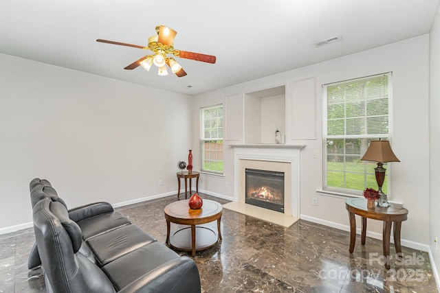 15037 Taylor Ridge Ln Unit 25, Charlotte, NC 28273 - living room featuring ceiling fan, a glass covered fireplace, baseboards, and marble finish floors