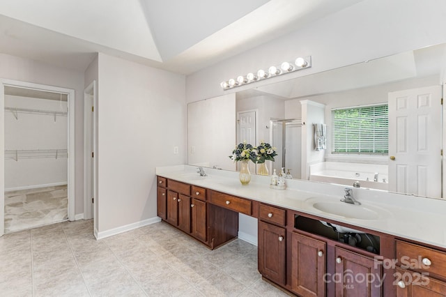 15037 Taylor Ridge Ln Unit 25, Charlotte, NC 28273 - bathroom with a stall shower, a bath, double vanity, and a walk in closet