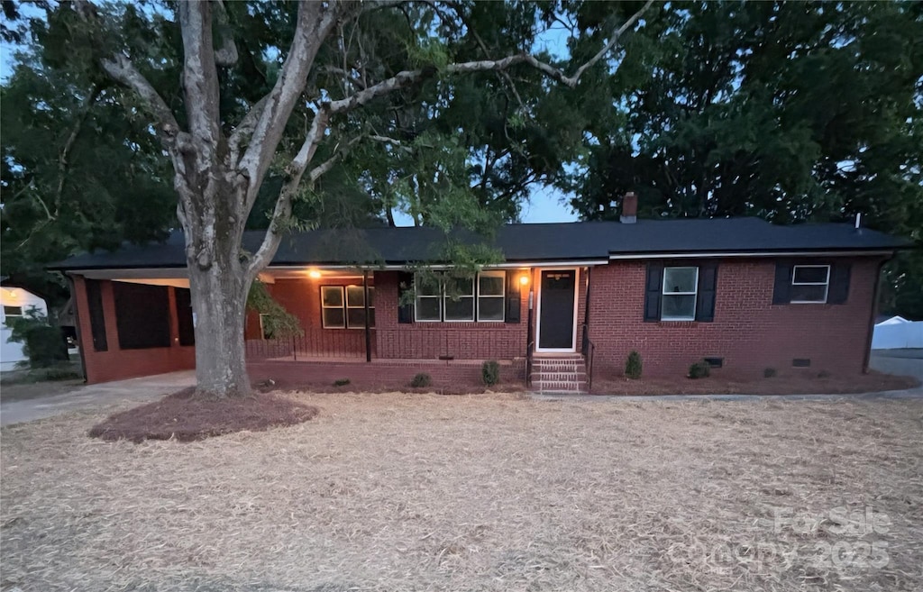 ranch-style house with brick siding and crawl space