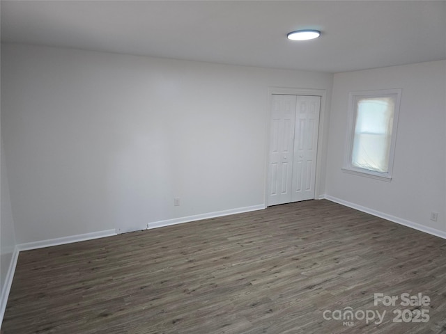 1900 Walkup Ave Unit 1, Monroe, NC 28110 - empty room featuring dark wood-type flooring and baseboards