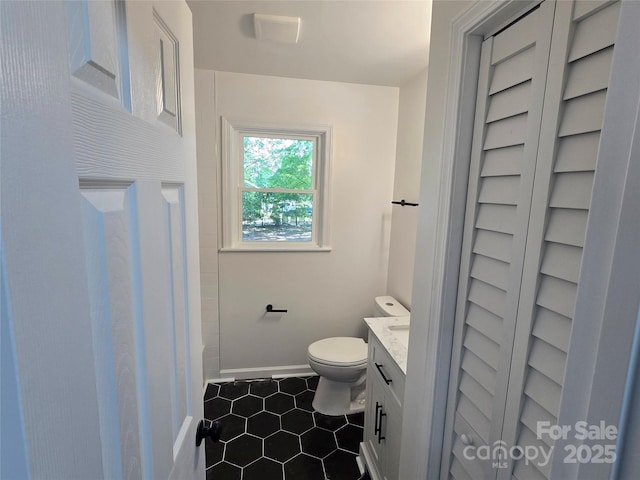 1900 Walkup Ave Unit 1, Monroe, NC 28110 - bathroom featuring vanity, tile patterned floors, toilet, and baseboards