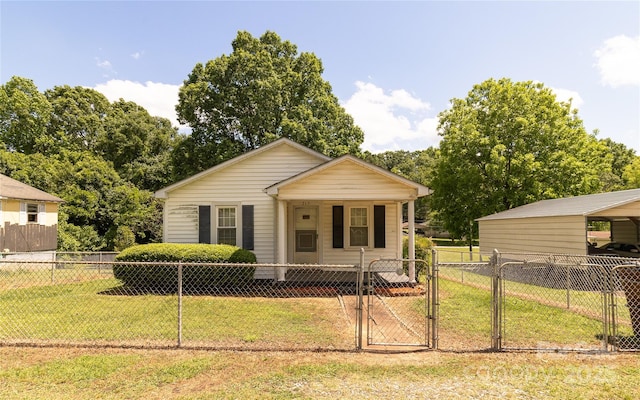 view of front of property featuring a gate, fence private yard, a front lawn, and a porch