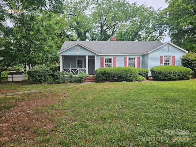 6407 Market St, Charlotte, NC 28215 - single story home featuring a chimney, roof with shingles, and a sunroom