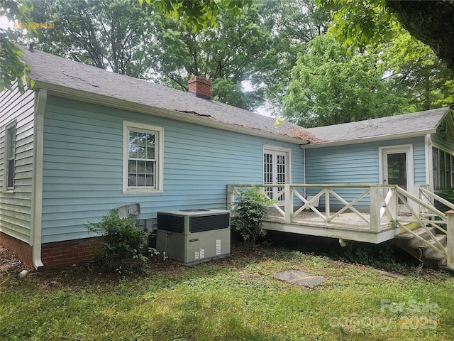 6407 Market St, Charlotte, NC 28215 - rear view of house featuring a deck, cooling unit, and a chimney