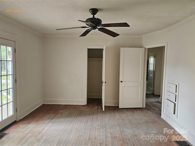 6407 Market St, Charlotte, NC 28215 - unfurnished bedroom featuring light wood-type flooring, ornamental molding, baseboards, and a ceiling fan