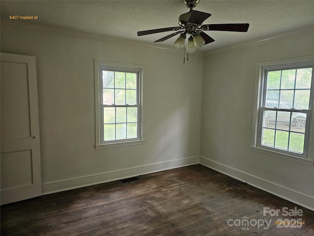 6407 Market St, Charlotte, NC 28215 - unfurnished room with plenty of natural light, crown molding, dark wood-type flooring, a textured ceiling, and baseboards