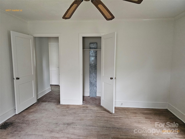 6407 Market St, Charlotte, NC 28215 - unfurnished bedroom featuring wood finished floors, crown molding, baseboards, and ceiling fan