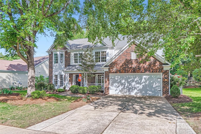 7600 Ridgefield Dr, Charlotte, NC 28269 - view of front facade with driveway, roof with shingles, brick siding, and a garage