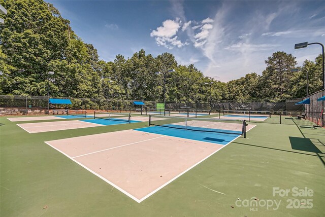 7600 Ridgefield Dr, Charlotte, NC 28269 - view of tennis court featuring fence and community basketball court