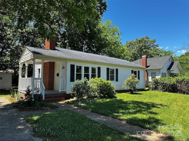 1119 Sanders St, Rock Hill, SC 29732 - view of front of home with a porch, roof with shingles, a chimney, and a front yard