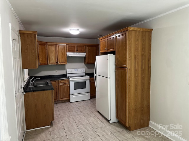 1119 Sanders St, Rock Hill, SC 29732 - kitchen with under cabinet range hood, white appliances, a sink, brown cabinets, and dark countertops