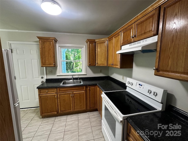 1119 Sanders St, Rock Hill, SC 29732 - kitchen featuring brown cabinets, a sink, white electric stove, freestanding refrigerator, and under cabinet range hood